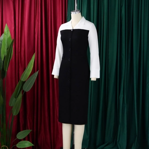 Detail of the contrast black and white long sleeve dress with button-up collar and lapel