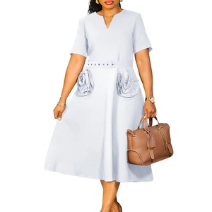 Detail of light blue A-line dress featuring 3D floral pockets and waist belt