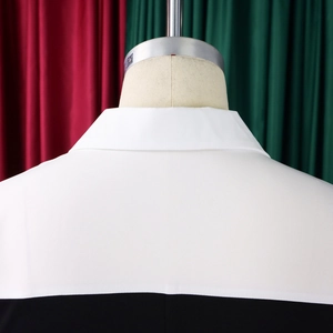 Close-up of contrast black and white pencil dress collar and paneled back stitching
