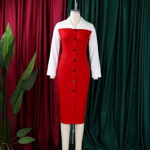 Detail of red and white color-block dress showing collar and black button closure