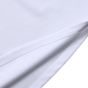 Detail shot of the white dress featuring high-quality double-needle stitching and side slit