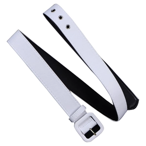 Detail of a white faux leather belt with a square buckle and silver pin closure