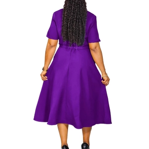Rear view of purple short-sleeved A-line midi dress with slim waist and flowing fabric