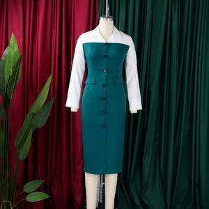Detail of teal and white patchwork pencil dress featuring lapel and button closure