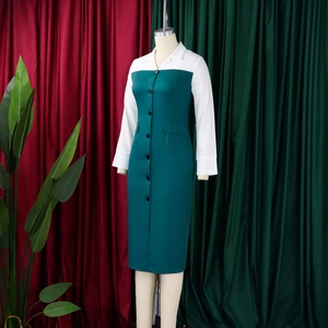 Detail of office pencil dress with notch lapel collar and dark green patchwork body