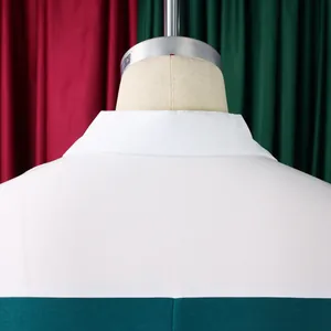 Detail of the back collar and seam on a white and forest green contrast pencil dress