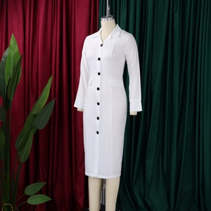 Detail of white long sleeve bodycon dress with black buttons and notched lapel