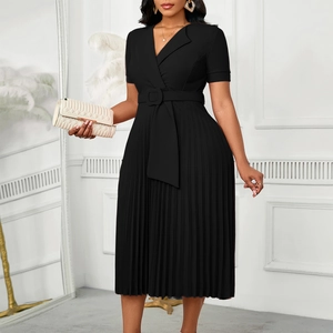 Detail of elegant black V-neck pleated dress with a matching waist belt and square buckle