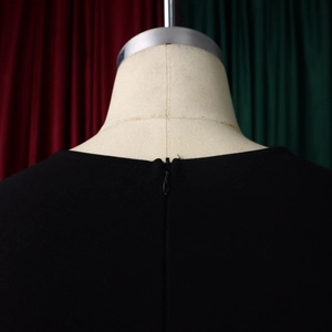 Detailed back view of a black V-neck dress featuring a hidden zipper closure