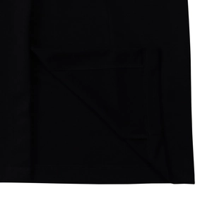 Detail view of the black bodycon dress showing high-quality double-stitch hem and fabric