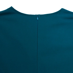 Detailed back view of a deep teal dress featuring a smooth concealed zipper and neat stitching