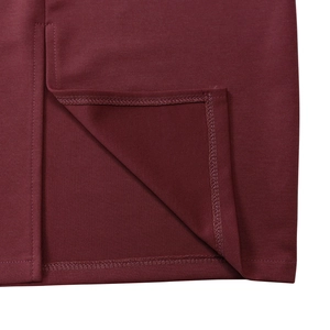 Close-up of wine red dress hemline showing high-quality stitching and fabric texture