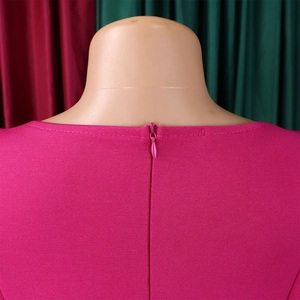 Close-up of the invisible back zipper on this elegant rose red puff sleeve dress