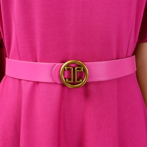 Detail of rose pink dress fabric texture with gold metal buckle belt and waist accents