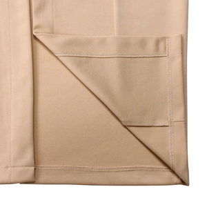 Close-up of high-density stitching and hem detail on a camel pencil dress fabric