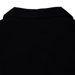 Detail view of the elegant black dress back showing the lapel and invisible zipper closure