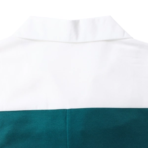 Detail of contrast stitch patchwork on the back collar of the two-tone business dress