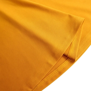 Detailed close-up of ginger yellow dress fabric showing premium twin needle stitching
