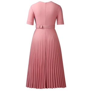 Detail of pink pleated short sleeve dress with matching buckled waist belt and A-line hem