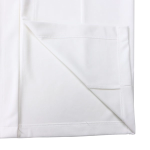 Close-up of clean double-needle stitching on a white professional pencil dress hemline