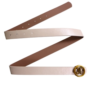 Detail of cream and brown dual-tone faux leather belt with golden JC round buckle