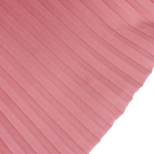 Detailed close-up of vibrant pink pleated chiffon fabric texture on a V-neck dress