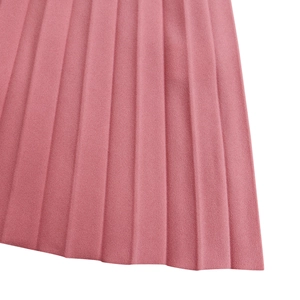 Close-up of pleated rose pink fabric texture on V-neck elegant maxi dress detail