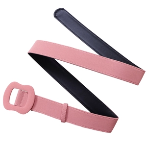 Detail of pink faux suede belt with matching rectangular buckle and neat edge stitching