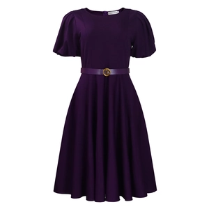 Close-up of deep purple A-line dress featuring puff sleeves and belt with golden buckle