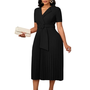 Detail of elegant black pleated dress showing blazer collar and belted waistline