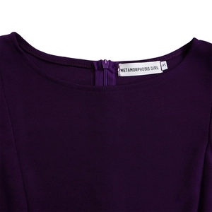 Detailed close-up of dark purple round neck with invisible zipper and brand tag
