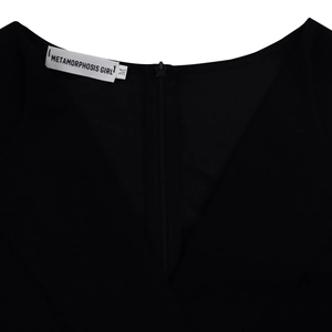 Detail view of the black V-neck dress featuring an invisible back zipper and M size label