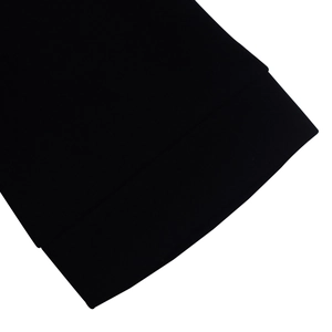 Close-up of premium black fabric texture with high-quality stitching on dress cuff