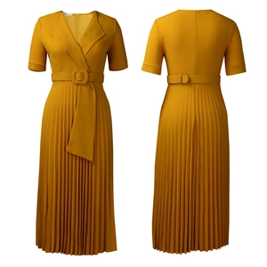 Detail of elegant mustard yellow pleated dress with V-neckline and matching belt