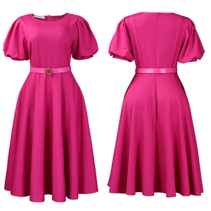 Detail of rose pink puff sleeve dress with elegant round neck and waist belt with gold buckle