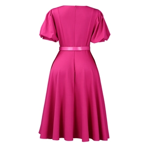 Detail view of hot pink A-line dress with bubble sleeves and back invisible zipper