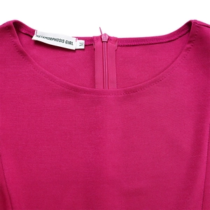 Detail of rose red round neck dress showing back zipper and knit fabric texture
