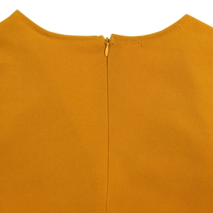 Detail view of mustard yellow dress featuring a high-quality invisible back zipper closure