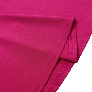 Detailed close-up showing fine stitching and rose red knitted fabric texture of the dress