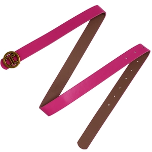 Close-up of bright pink leather belt with golden round buckle and brown inner lining