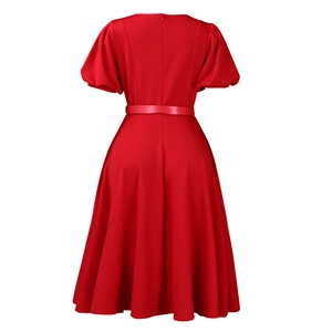 Detail view of red puff sleeve dress showing the high waist back and invisible zipper