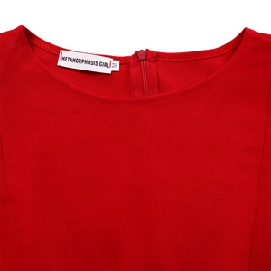 Detail of red crew neck dress featuring back invisible zipper and brand neck label