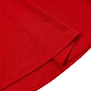 Detail of red fabric texture and neat double-stitching on the sleeve of an elegant dress