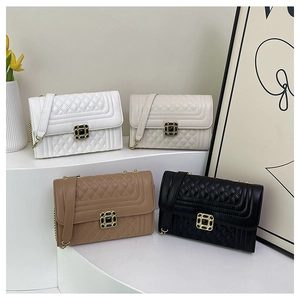 Quilted crossbody bags in four colors with gem buckles and chain shoulder straps