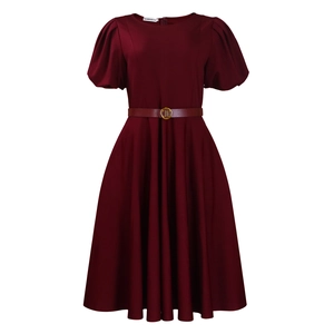 Detail of burgundy A-line dress showing round neck, puff sleeves and gold buckle belt