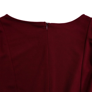 Detail of invisible back zipper closure and round neckline on a burgundy dress
