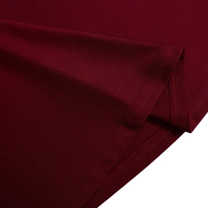 Detail of double-needle stitching and knit fabric texture on a wine red A-line dress