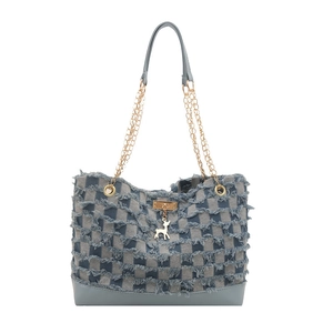 Denim tote bag with checkered pattern, frayed edges, and golden deer charm on white background