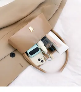 Detailed interior view of a brown baguette bag showing ample space for daily essentials