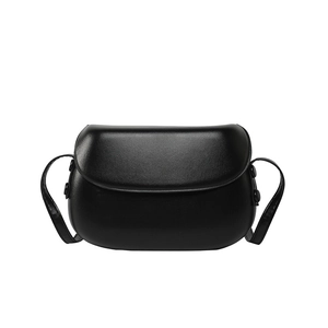 Minimalist black leather saddle crossbody bag with adjustable strap for women
